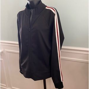 Sports jacket with side pocket, inside pockets for cell phone and thumb holes.